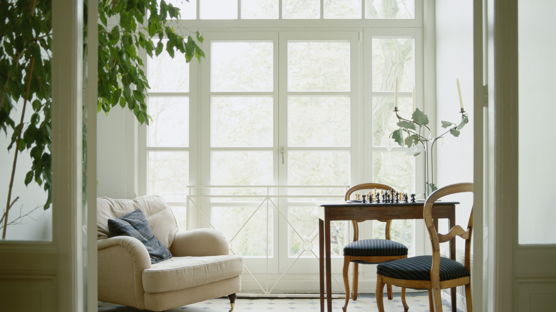 Soft natural light filling a quiet room with simple furniture, creating a calm, steady atmosphere.